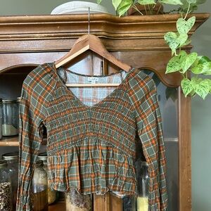 cropped green, orange plaid blouse with long sleeves, ruffle hem smocked chest